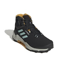 adidas Trail-Wanderschuhe Terrex AX4 MID Beta Cold.RDY (PrimaLoft Isolation & Fleecefutter) schwarz/gelb Herren